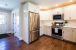 Sparkling open kitchen with stainless steel appliances 